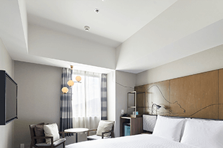 Spacious guest room with high ceilings