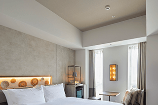 Spacious guest room with high ceilings